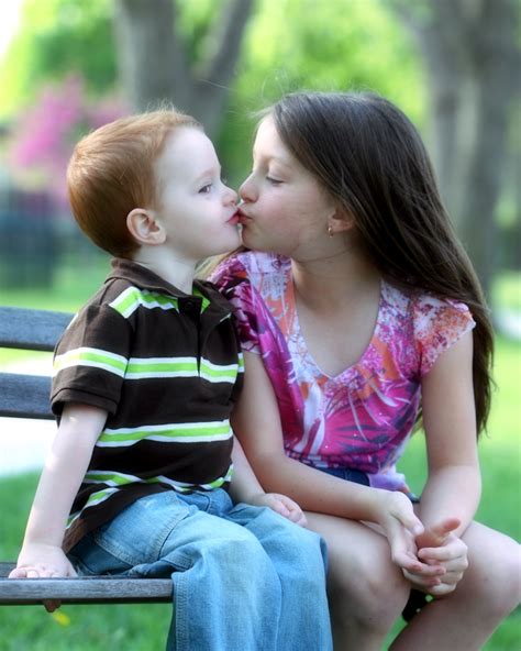 couple about to kiss|kid girl and boy kissing.